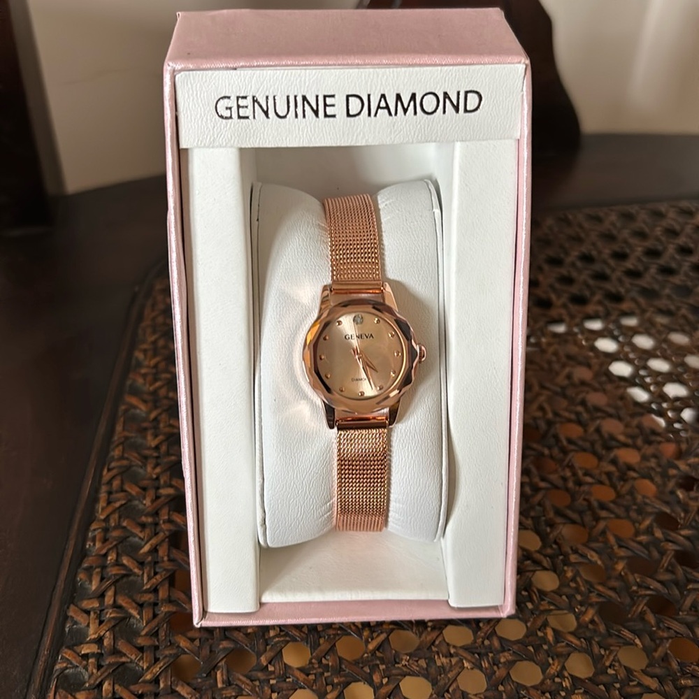 Geneva genuine diamond collection women’s watch.
